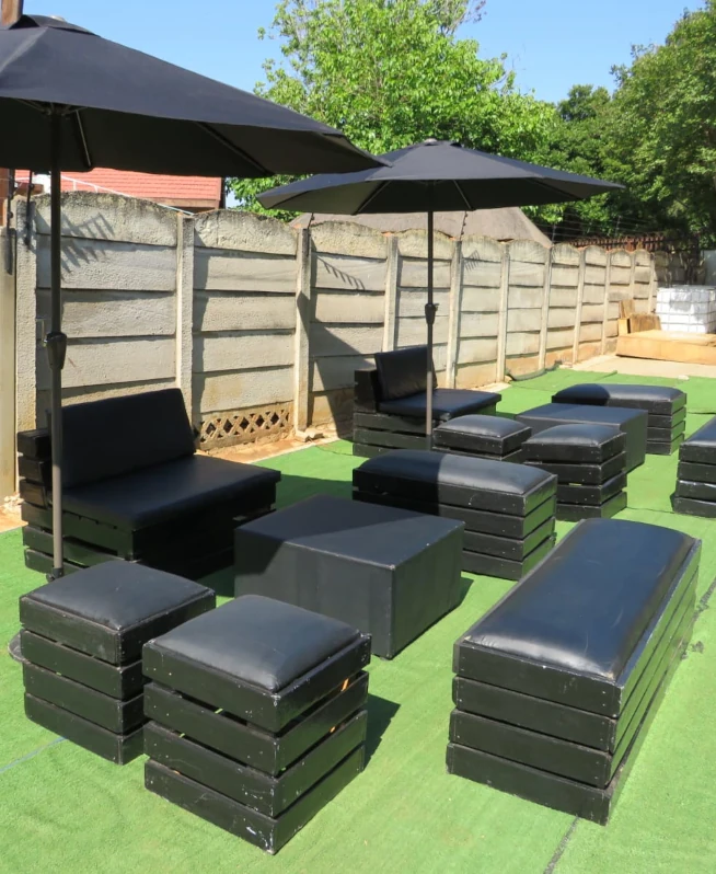 Black tent and couches along with tables